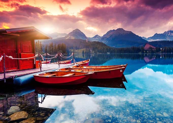Boats on a mountain lake at sunset