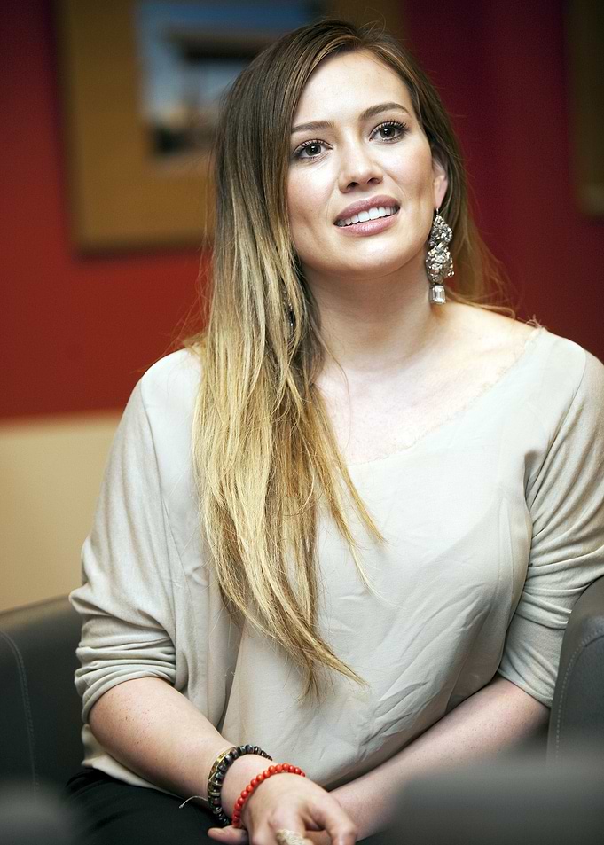 Hilary Duff in a beige top