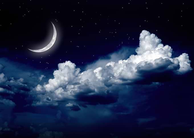 Crescent Moon in a Starry Night Sky