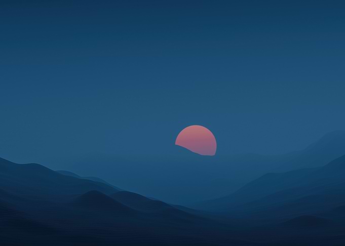 Sunset over misty mountains