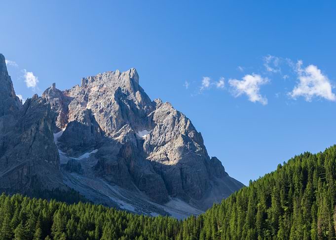 Majestic Mountain Peaks Under Blue Sky - Val Venegia