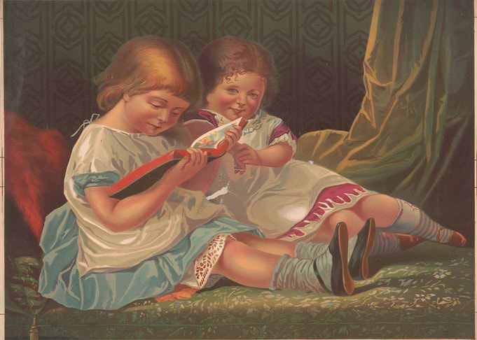 Two girls reading a book
