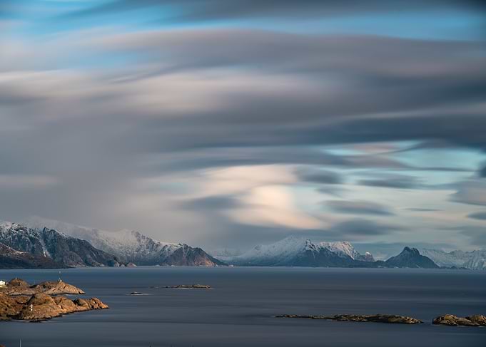 Long Exposure of Snowy Mountains and Sea