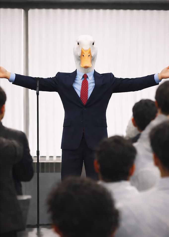 Man in Duck Mask Giving a Presentation