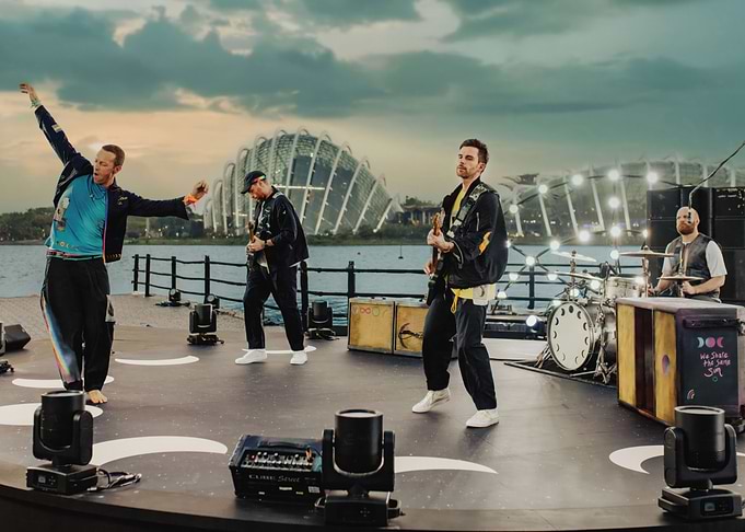 Coldplay performing live on stage