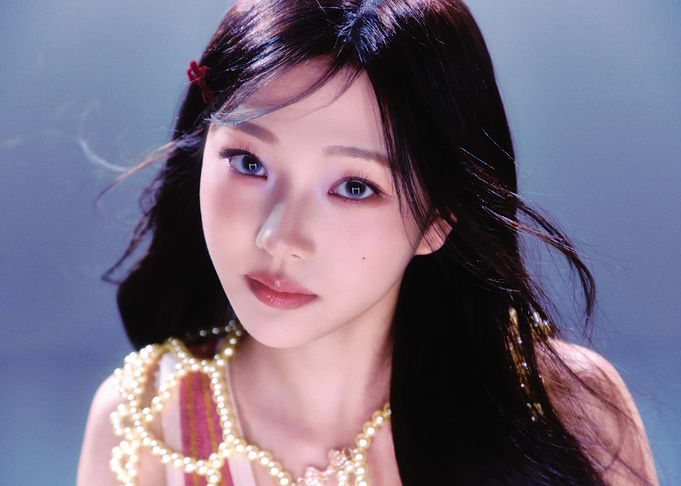 stella babymonster with dark hair and pearl necklace