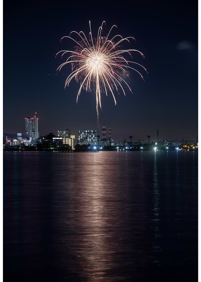 Fireworks over a city at night