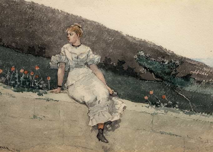 Woman in white dress sitting on wall