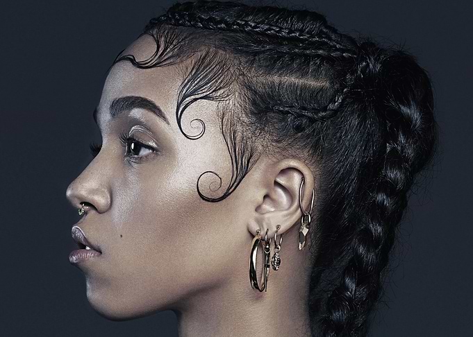FKA Twigs with intricate braided hairstyle and jewelry
