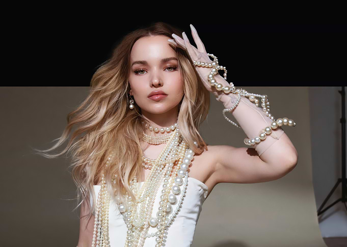 Dove Cameron in Pearls and White Dress