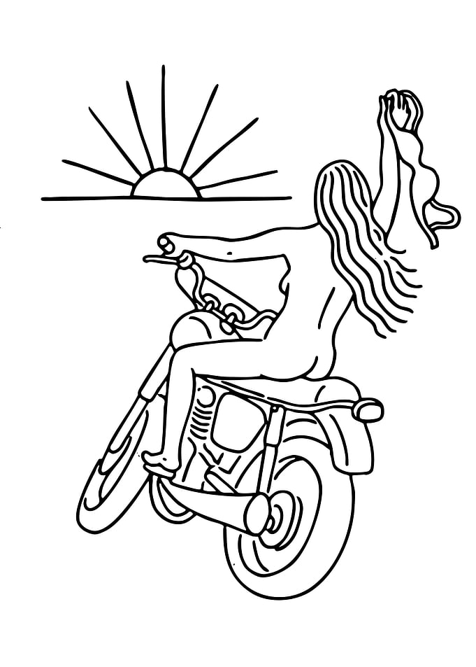 Woman riding a motorcycle at sunset