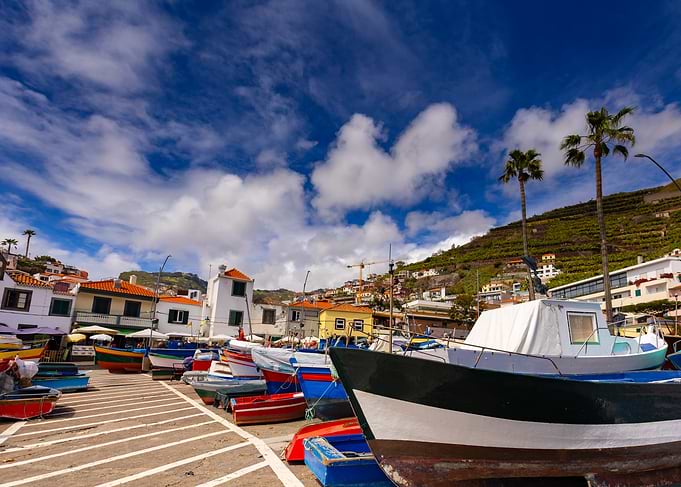Colorful boats in a coastal town harbor, Camara de Lobos