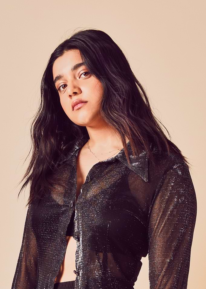 iman vellani in Sheer Metallic Shirt