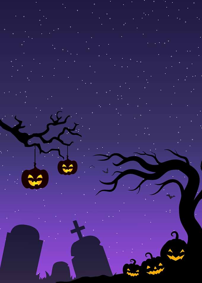 Halloween graveyard scene with pumpkins