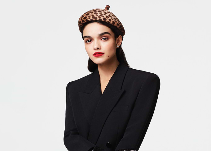Rachel Zegler in leopard print beret and black blazer