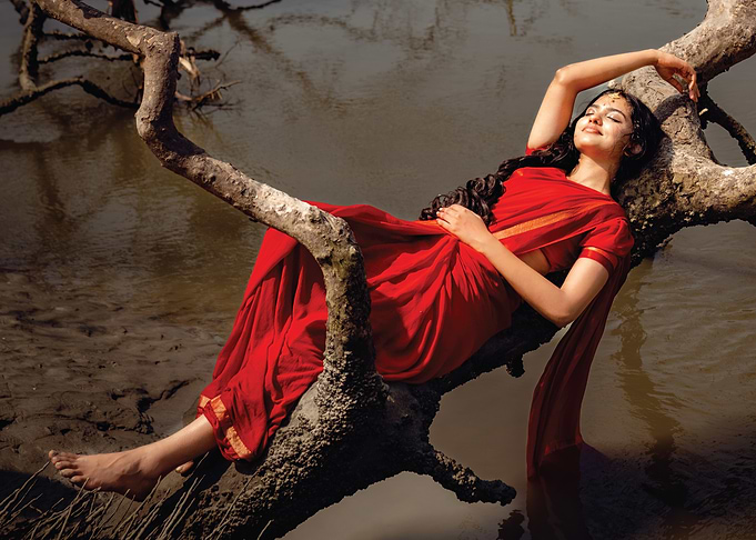 mamitha baiju in Red Saree on a Tree Branch