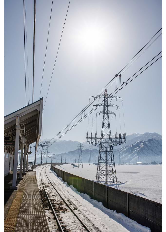 Snowy Train Station with Power Lines