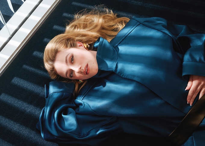 lili reinhart in blue satin robe lying down