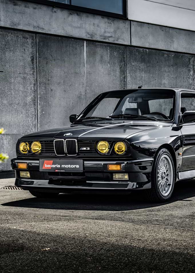 Black BMW M3 E30 with Yellow Headlights