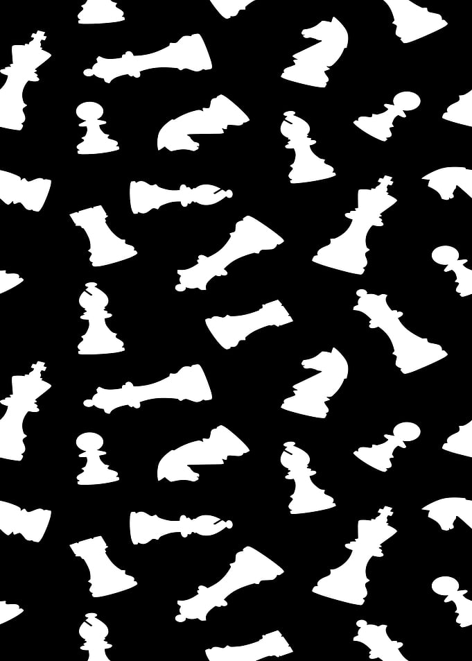 White Chess Pieces on Black Background