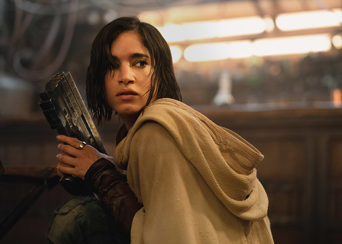 sofia boutella holding a futuristic weapon