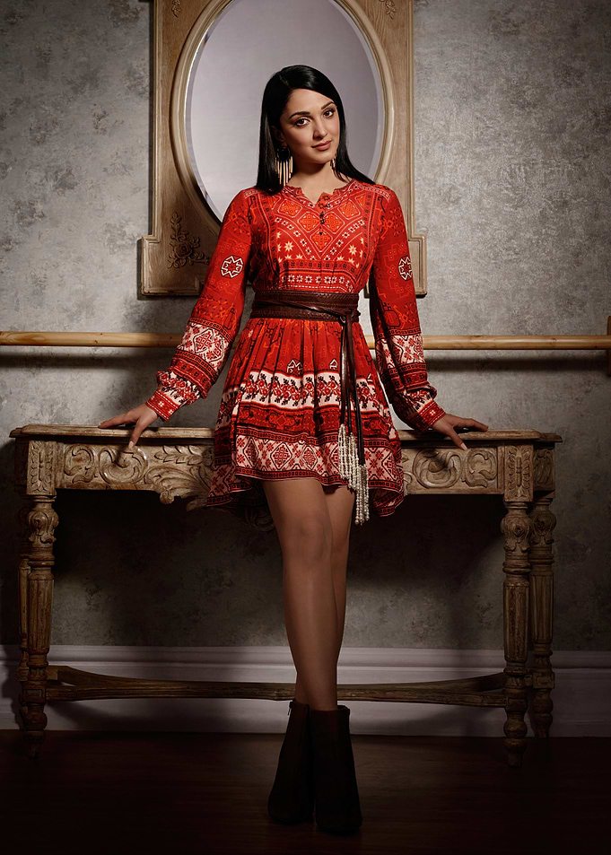 kiara advani in Red Dress Posing by Table