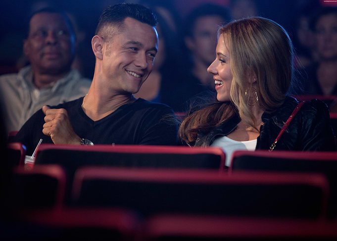 Couple laughing in movie theater