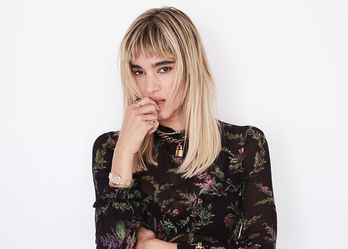 sofia boutella in floral sheer top with jewelry