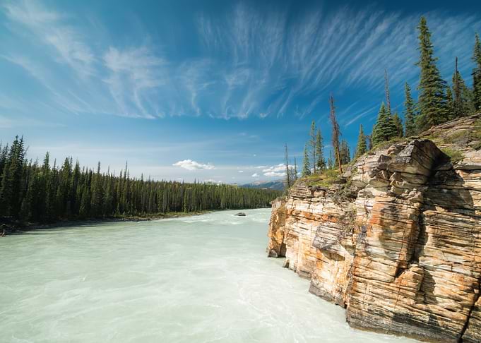 Turquoise River and Rocky Cliffs