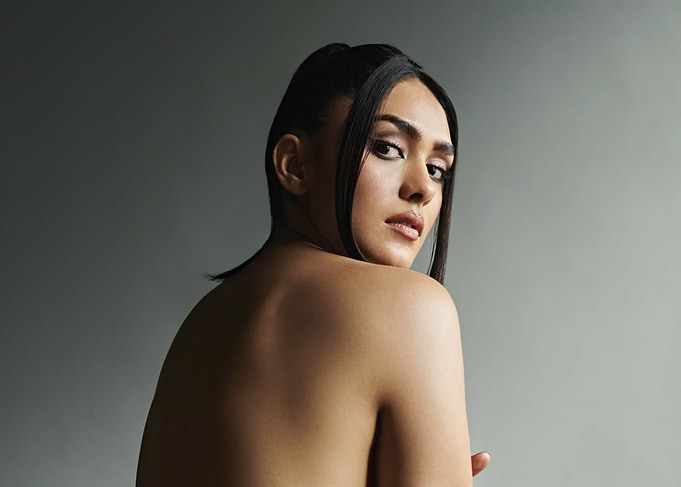 Mrunal Thakur looking over shoulder