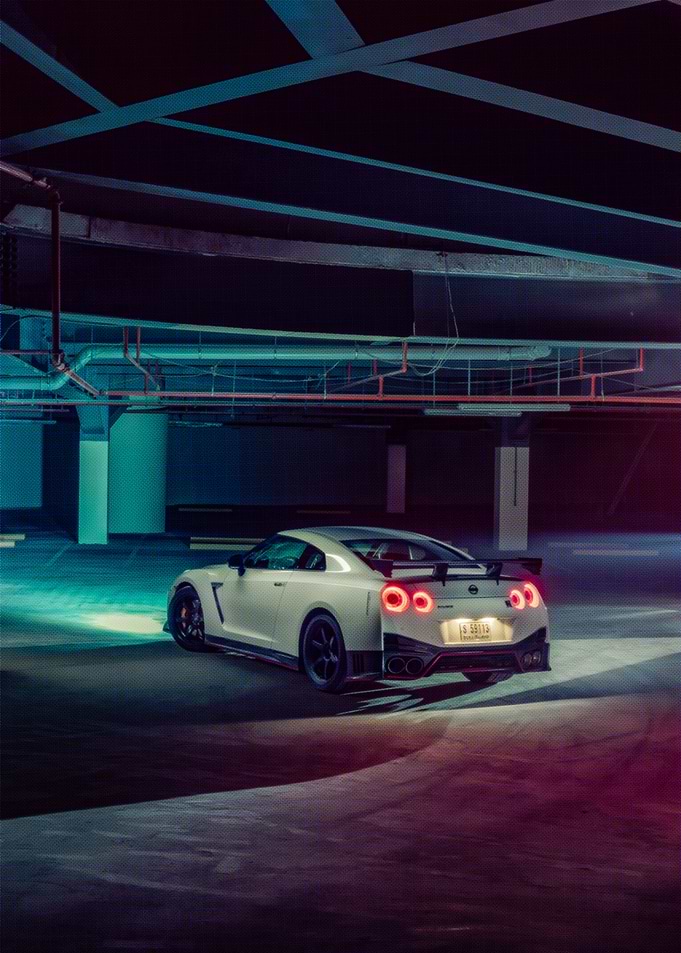 White Nissan GT-R in a dimly lit garage