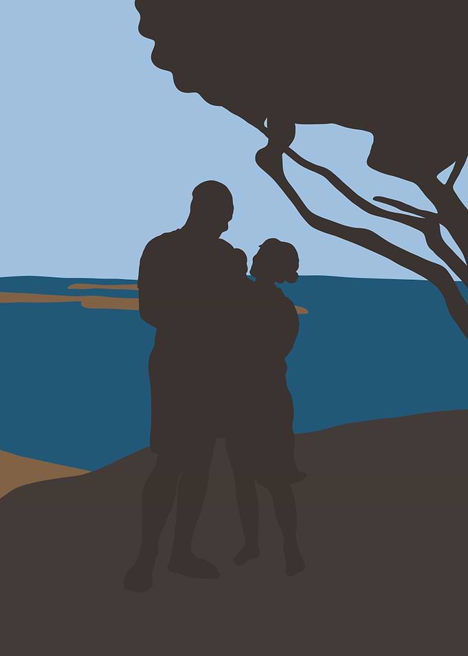 Couple under a tree by the sea