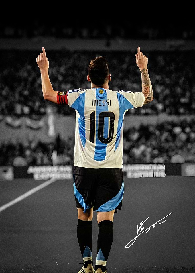 Lionel Messi celebrating with arms raised