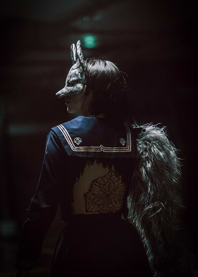 Person in Fox Mask and Sailor Uniform