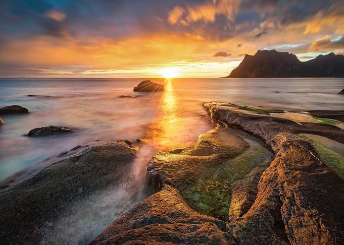 Sunset Over Rocky Coastline