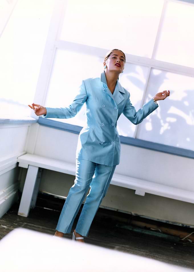 Woman in blue suit posing