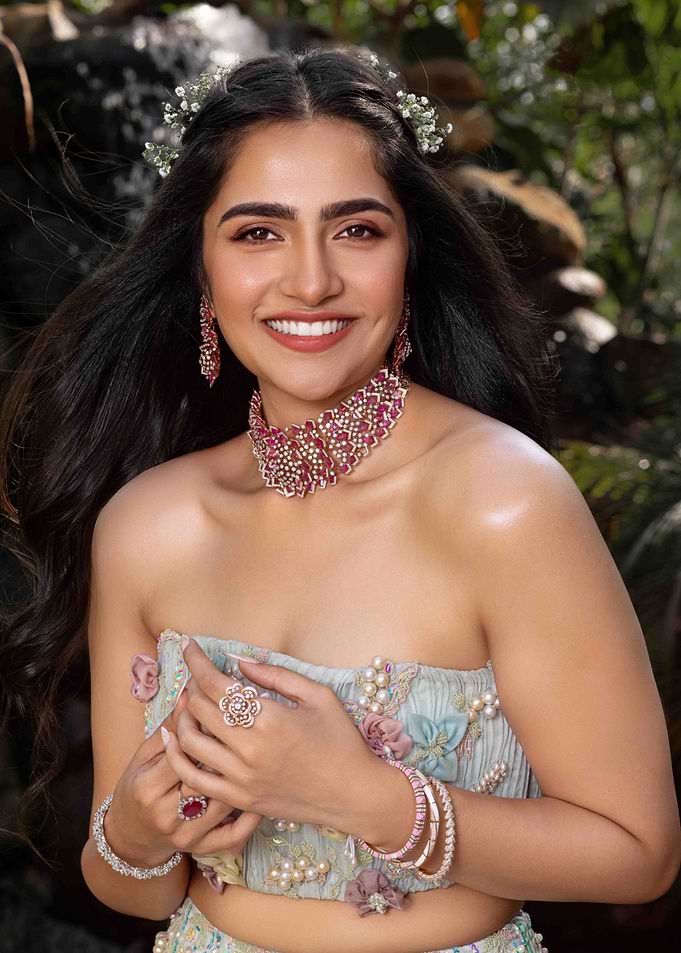 rukmini vasanth in ornate jewelry and floral dress