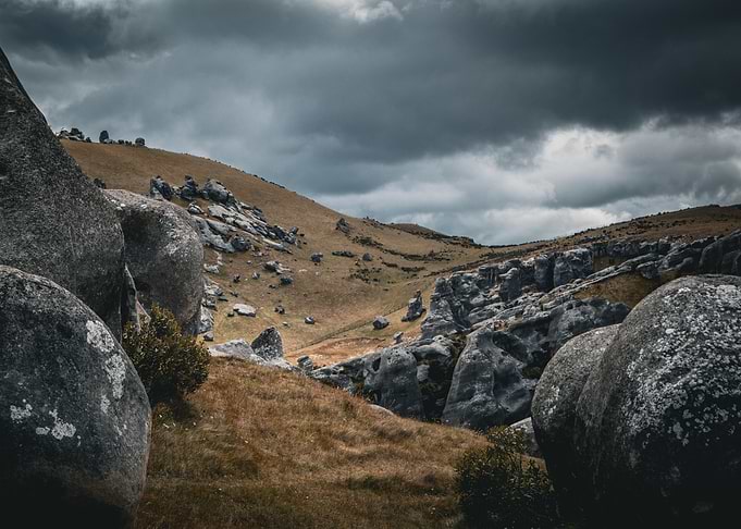 Dramatic Landscape with Boulders and Stormy Sky (Castle Hill, New Zealand)