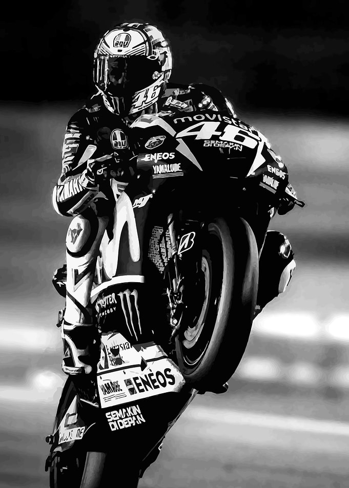 Motorcyclist performing a wheelie