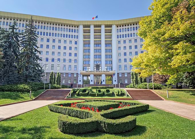Government Building with Moldovan Flag and Landscaping