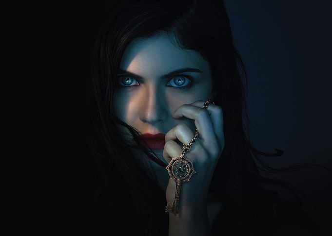 Alexandra Daddario with blue eyes and key necklace