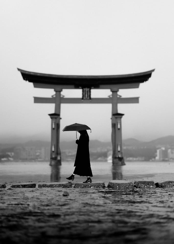 Woman with Umbrella at Torii Gate