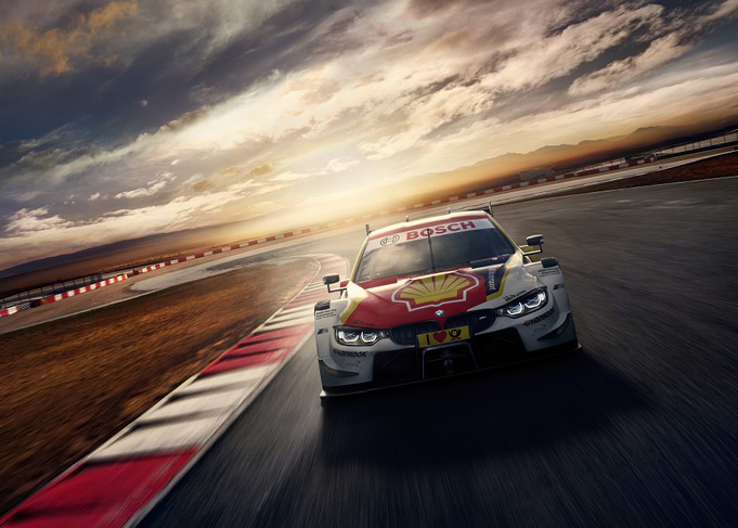 Race Car on Track at Sunset