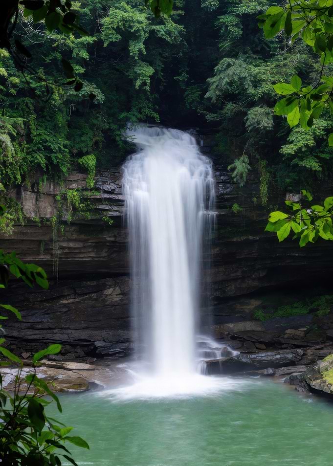 Misty Waterfall in Lush Forest