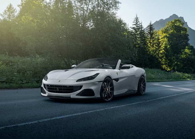White Ferrari Convertible on a Mountain Road