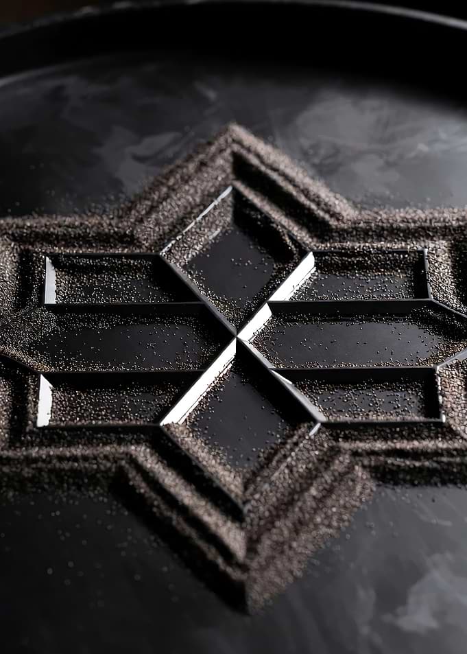 Sand Art on Black Surface