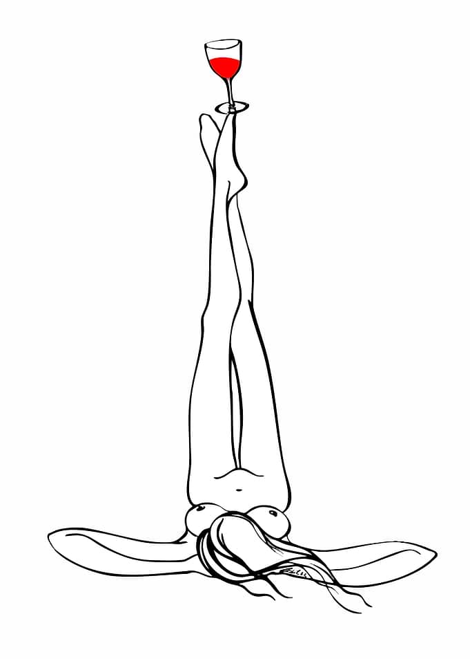 Woman balancing wine glass on feet