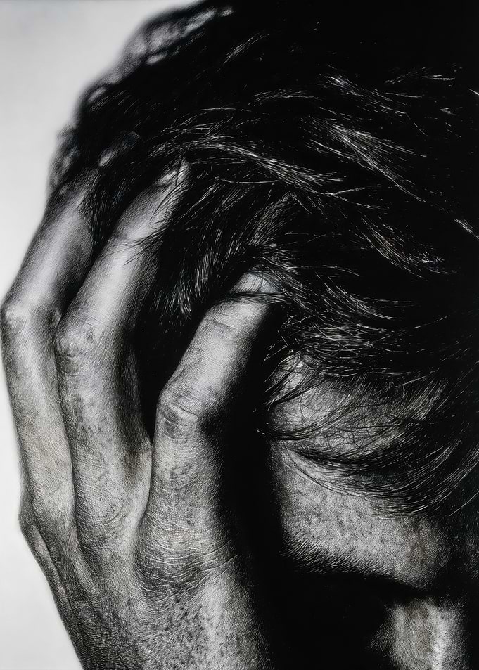 Hand Grasping Dark Messy Hair