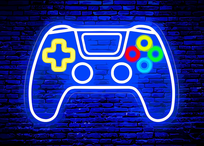 Neon Game Controller on Brick Wall