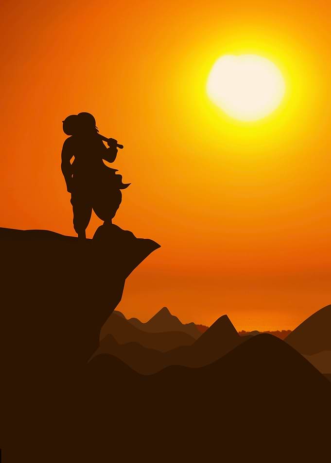 Silhouette of Krishna on a Cliff at Sunset